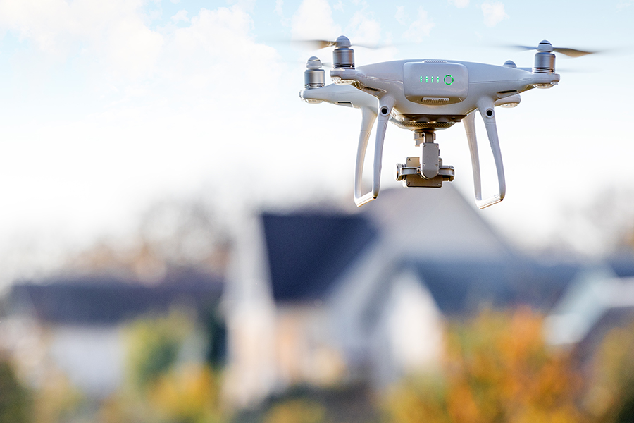 Aerial drone being flown over a house during an inspection by one of our home inspectors