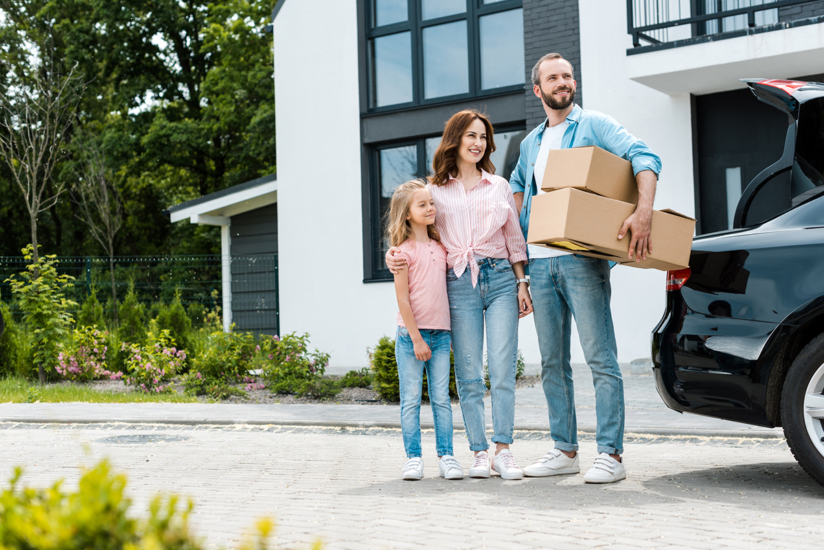 Happy family moving into their new house after a home inspection 