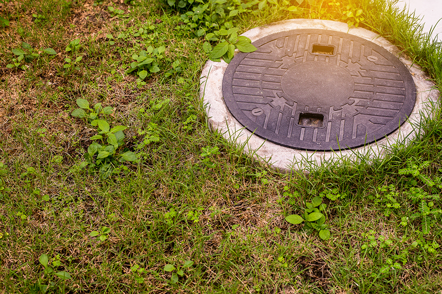 Opening to a septic tank seen while preforming home inspection services